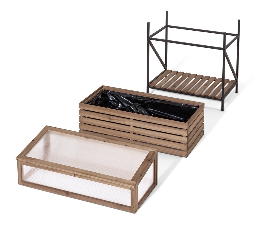 Une jardinière surélevée avec serre châssis « Elin » démontée avec un revêtement noir.