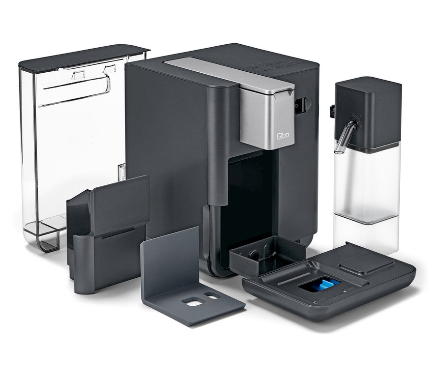 Une machine à café Qbo MILK MASTER Gentle Grey démontée.