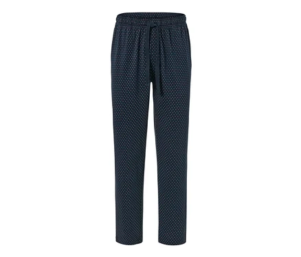 Pantalon relax bleu marine à pois roses.