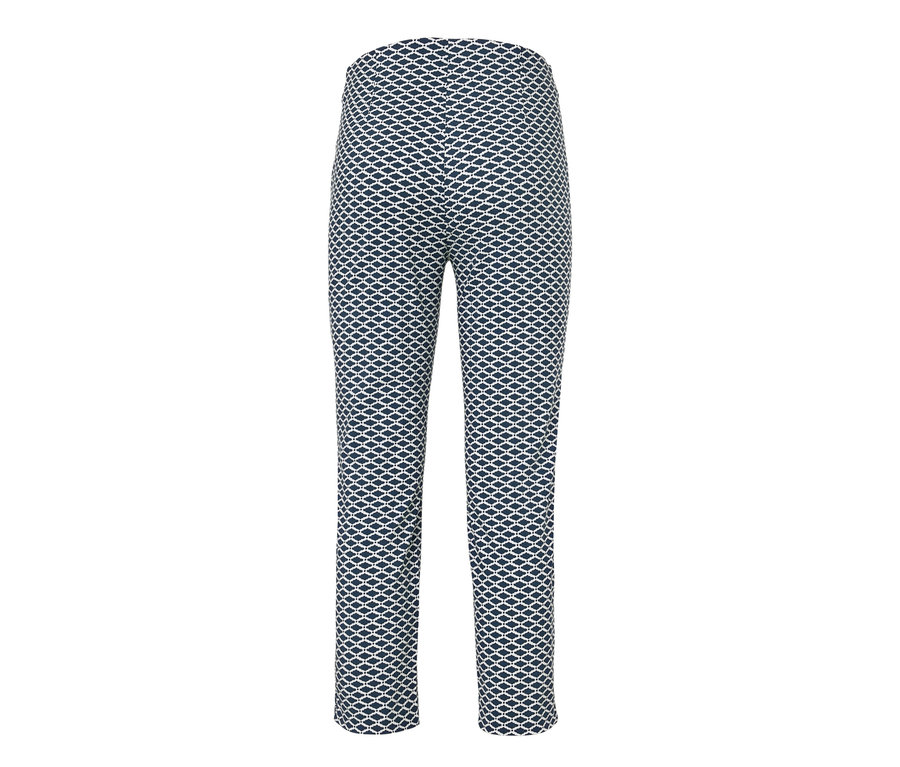 Un pantalon stretch imprimé 7/8 sur fond blanc.