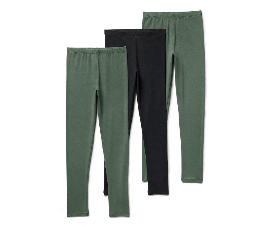Trois leggings pour enfant, un noir et deux verts.