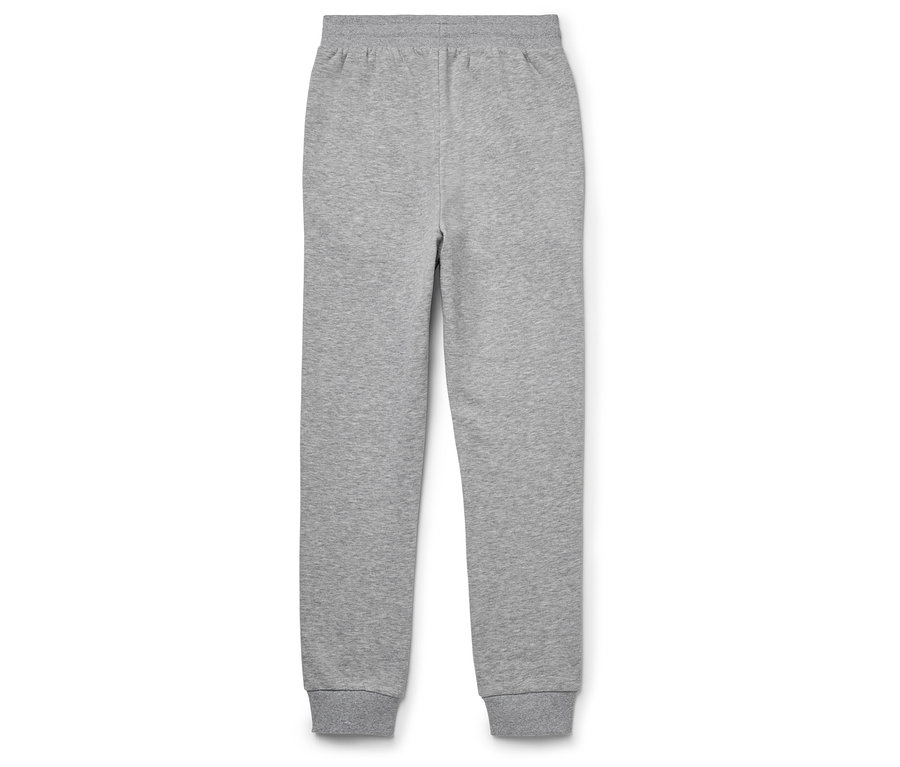 Un pantalon de survêtement gris est posé sur un fond blanc.