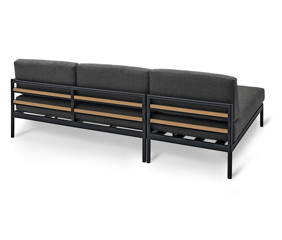 Vue arrière d'un canapé modulable gris avec un cadre noir et des détails en bois marron clair.