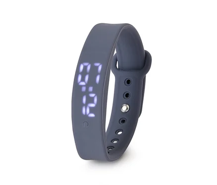 Montre numérique gris foncé avec bracelet en silicone, affichant 07:12, sur fond blanc.