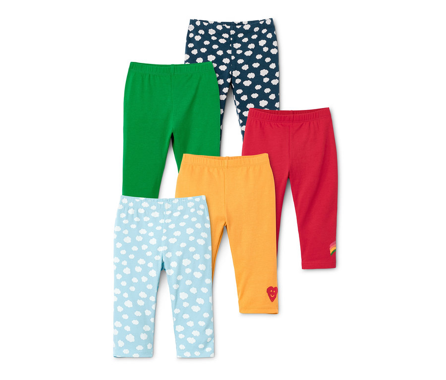 Cinq leggings en coton bio de différentes couleurs. Un vert, un rouge avec un arc-en-ciel, un orange avec un cœur et deux bleus avec des nuages.
