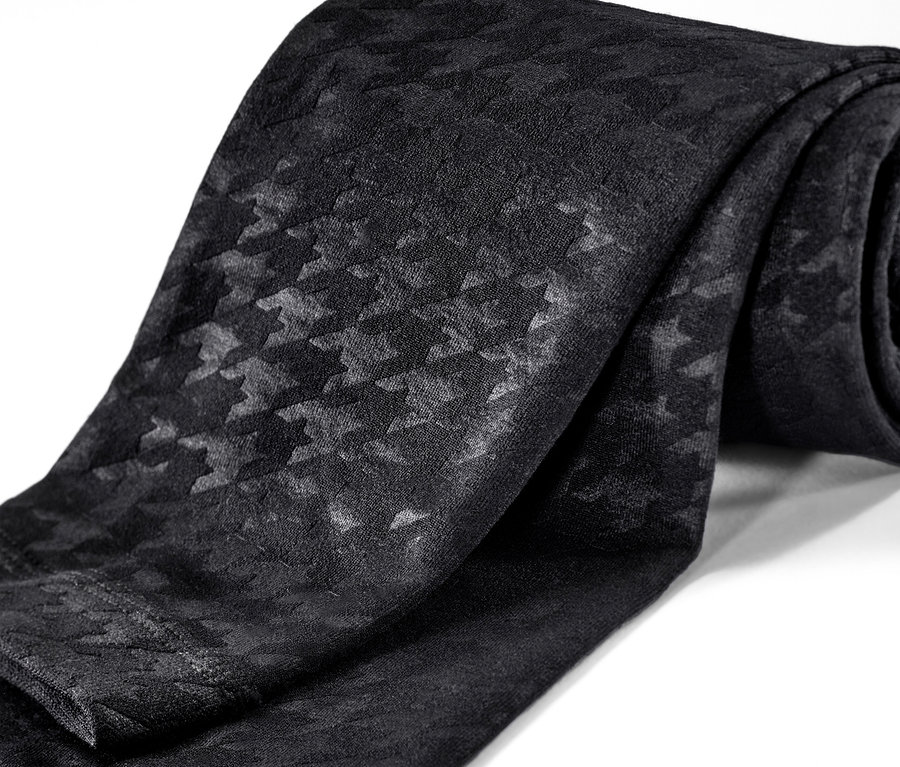 Gros plan d'un legging thermique noir avec relief.