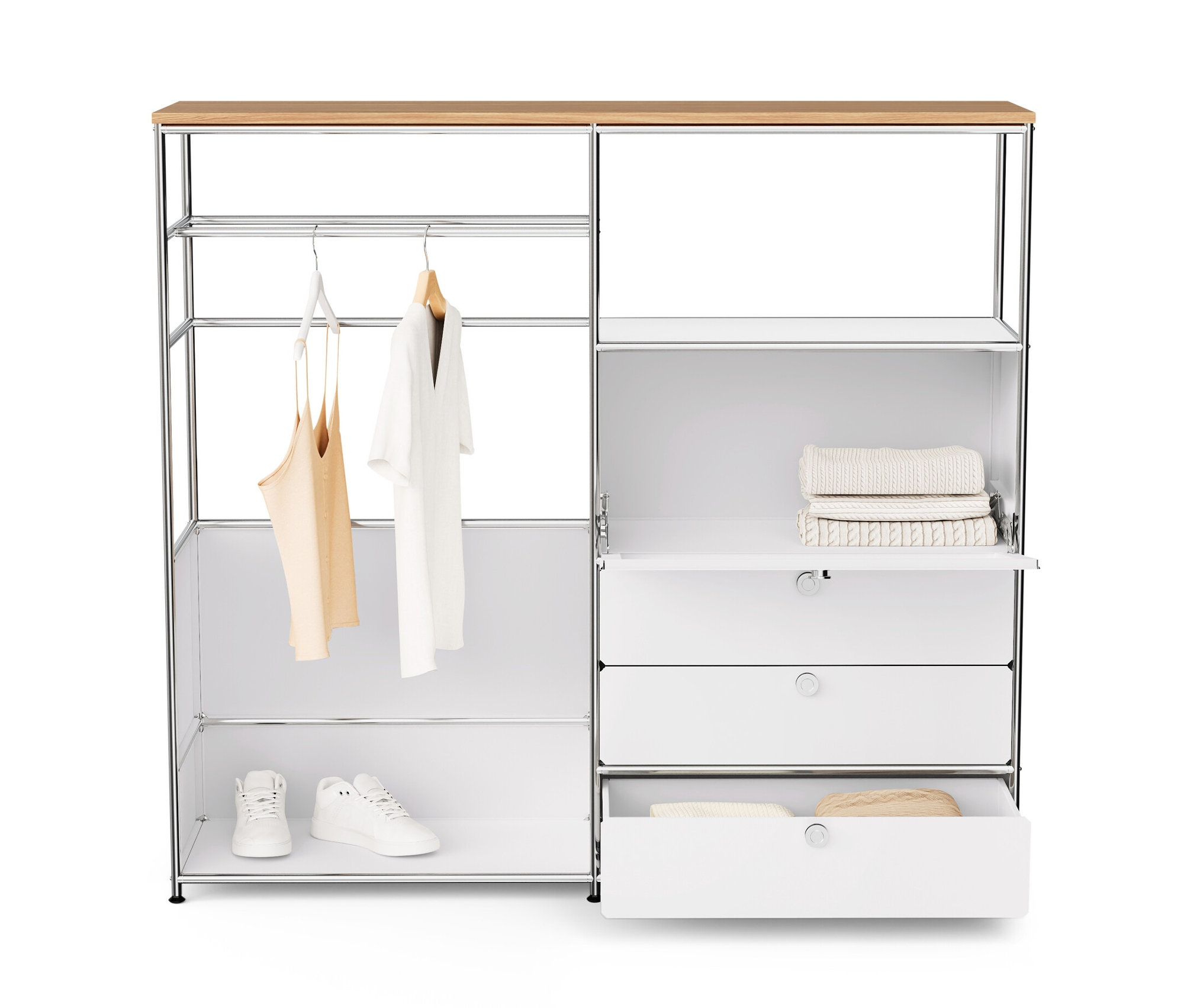 Commode en métal blanche « CN3 » avec plateau en bois, tringle à vêtements, abattant et 3 tiroirs. Des vêtements sont suspendus à la tringle, des chaussures et des pulls sont posés sur les étagères.