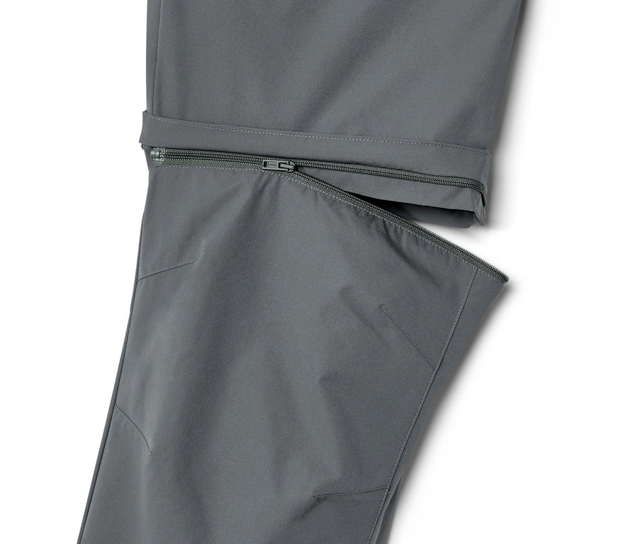 Détail d'un pantalon fonctionnel 2 en 1 gris avec fermeture éclair.