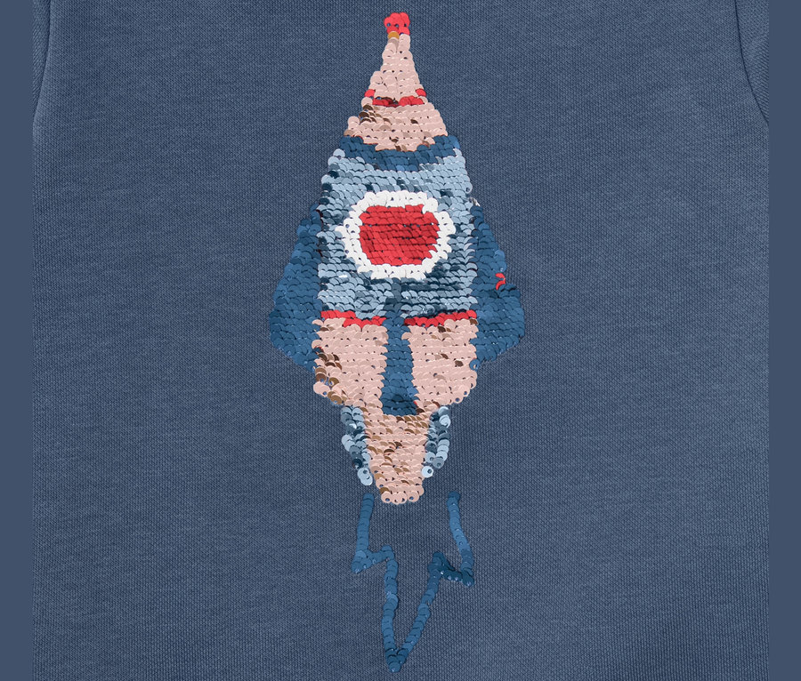 Détail d'un Sweatshirt pour enfant avec motif réversible, fusée.