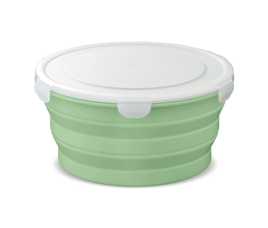 Un saladier repliable vert avec un couvercle blanc.