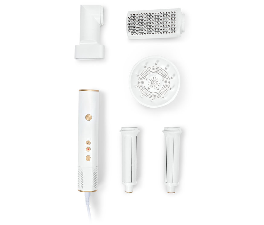 Appareil de coiffure multifonctionnel blanc avec différents accessoires.