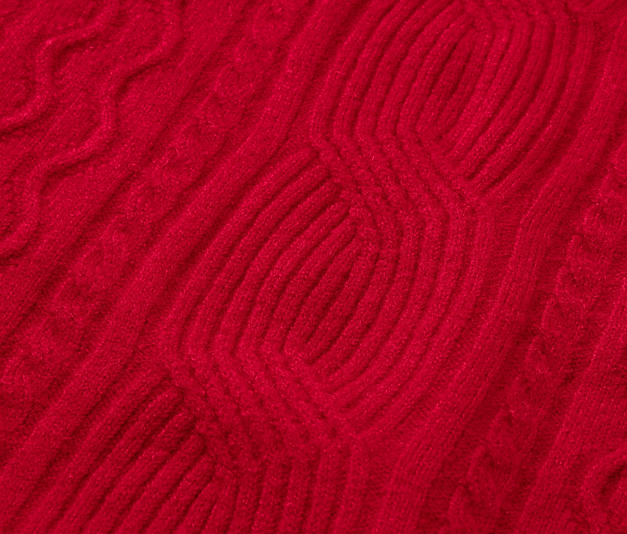 Gros plan d'un motif tricoté rouge.