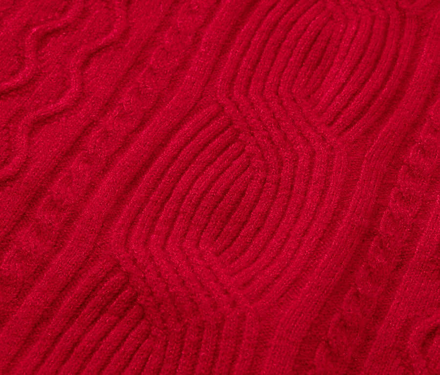 Gros plan d'un motif tricoté rouge.