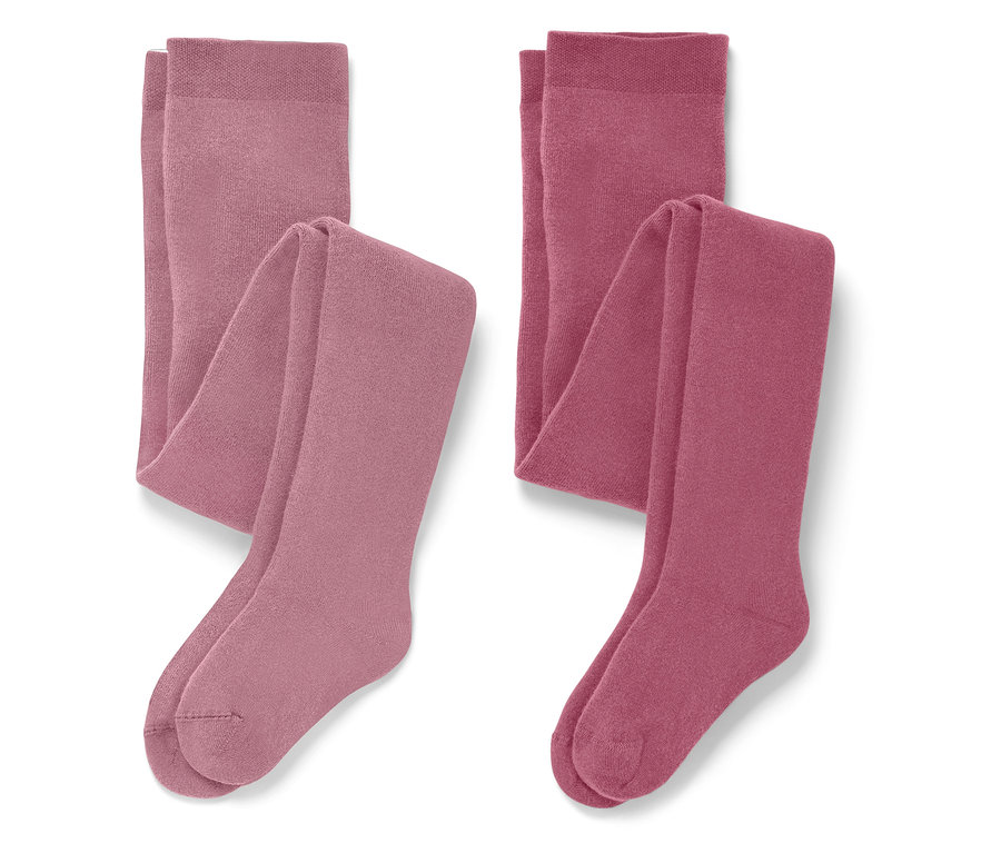 Deux paires de collants pliés dans des tons roses.