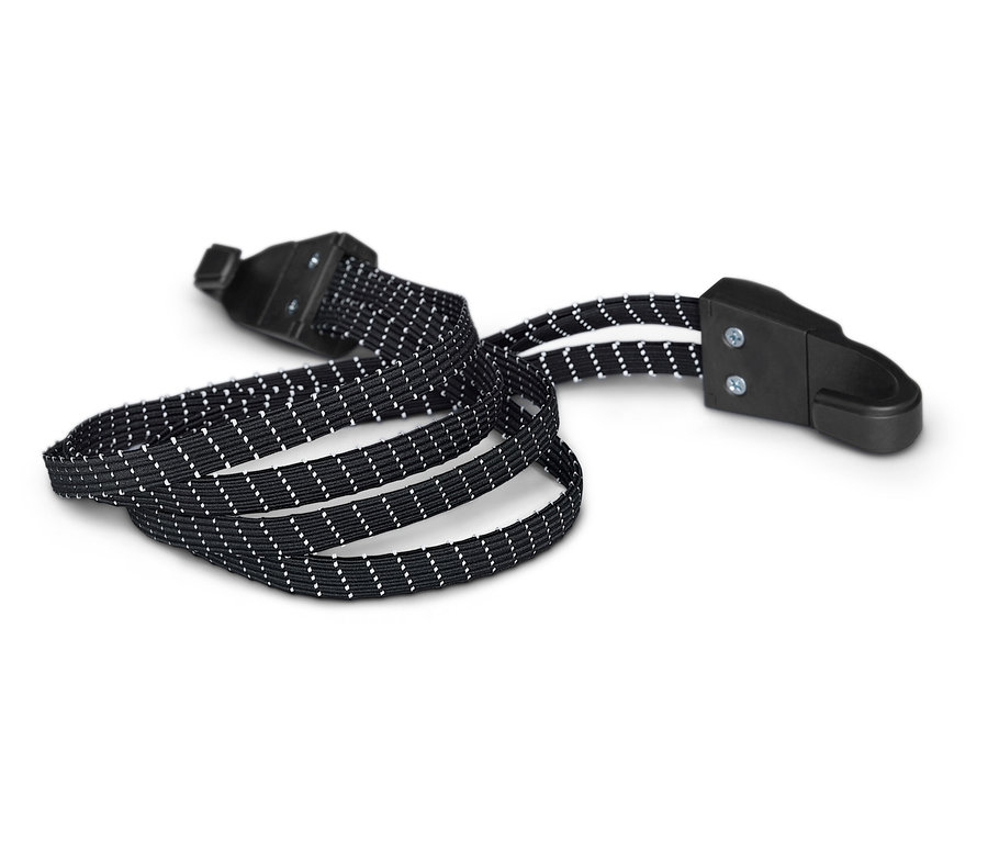 Sangle noire à pois blancs et boucles en plastique noir sur fond blanc.