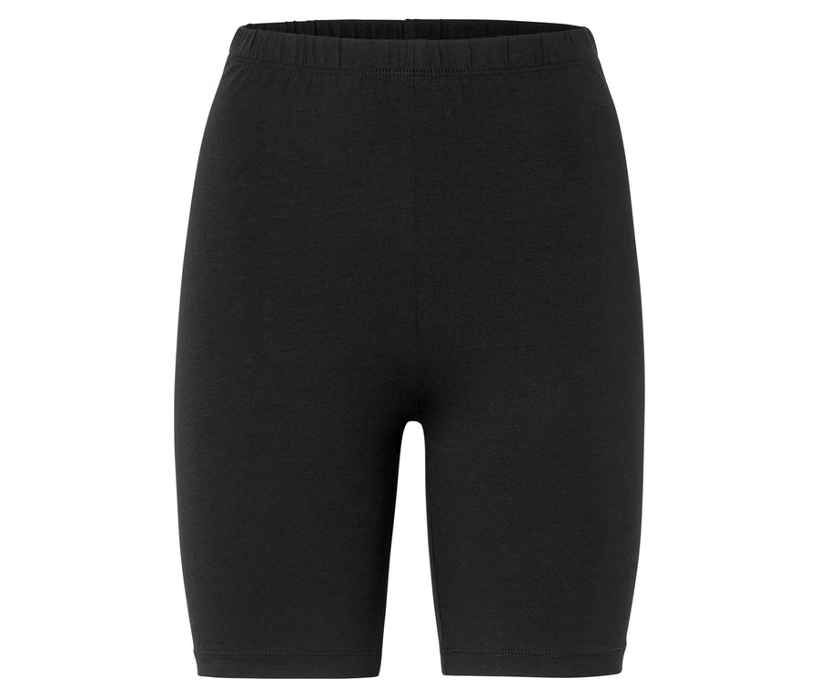 Short de cycliste noir sur fond neutre.