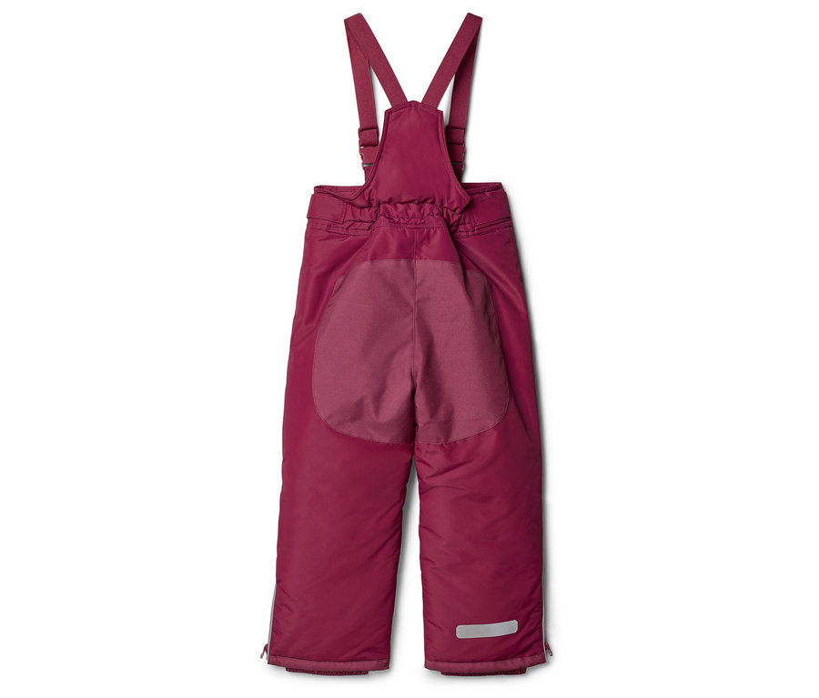 Un pantalon bordeaux doublé avec des bretelles est posé sur un fond blanc.