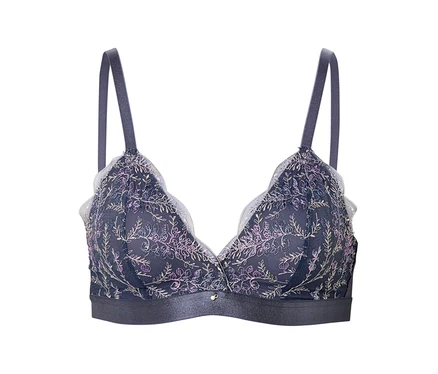 Soutien-gorge bleu marine avec broderie florale et bordures blanches.