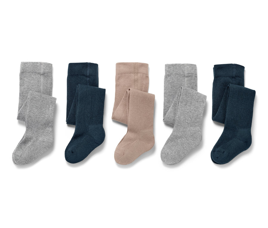 Cinq collants pour enfants en gris, bleu marine et beige.