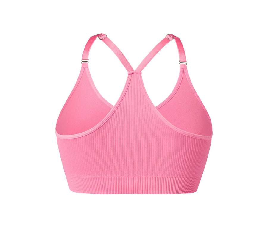 Détail d'une brassière de sport Seamless rose vif.