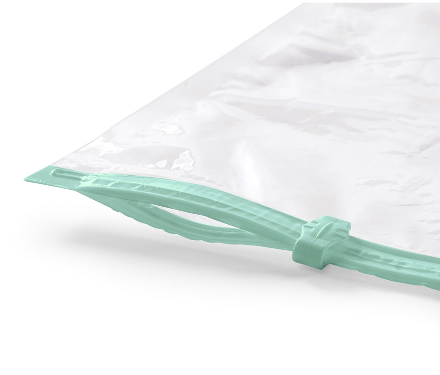 Gros plan sur un lot de 2 sacs de rangement sous vide plats avec fermeture éclair vert menthe.