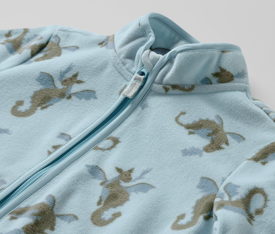 Veste polaire bleu clair Veste polaire pour enfant, dragon, avec imprimé dragon sur l'ensemble et fermeture éclair.