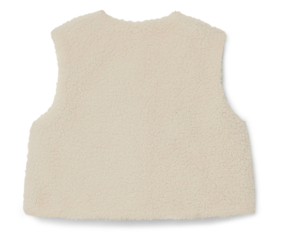 Gros plan d'un gilet en polaire crème sans manches.