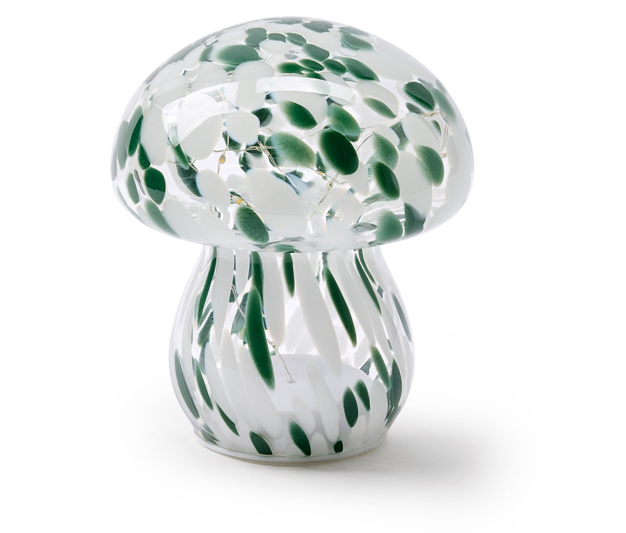 Lampe en forme de champignon en verre transparent avec des taches vertes et blanches et de petites lumières LED à l'intérieur.