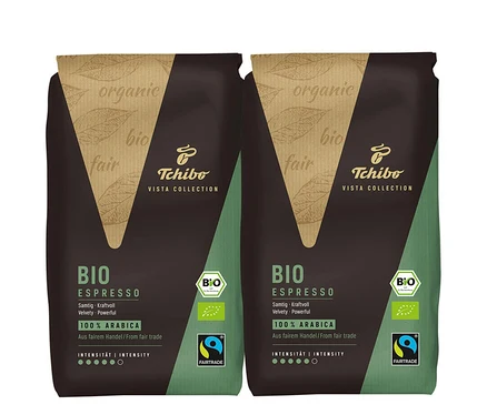 Deux paquets de BIO Espresso Tchibo VISTA COLLECTION. Les paquets sont marron et vert.