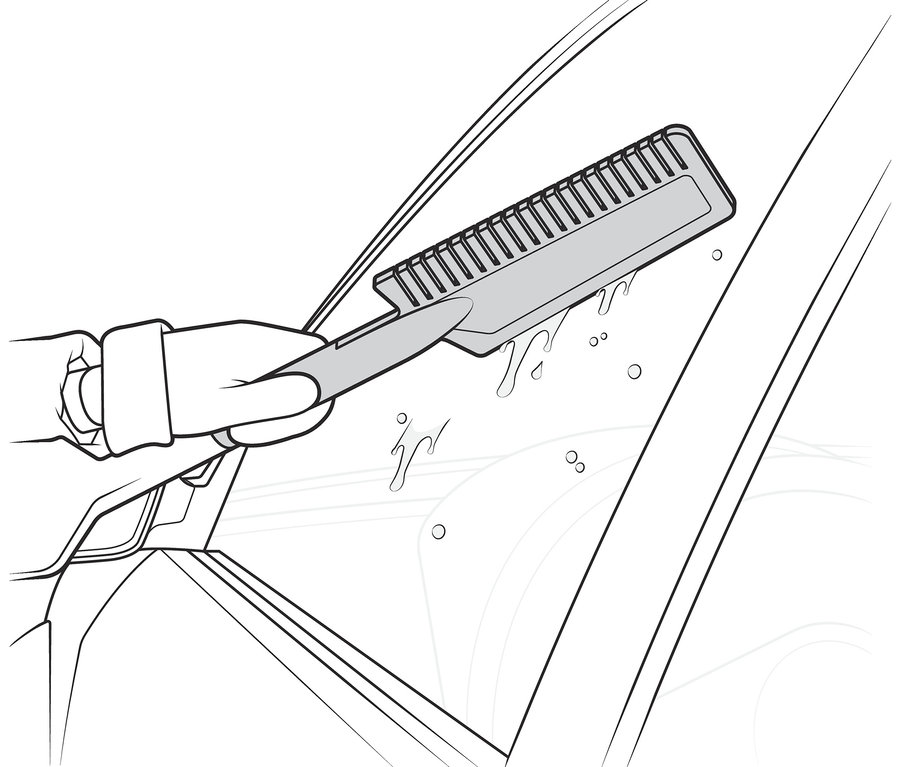 Une main gantée utilise une balayette-grattoir à neige pour voiture 3 en 1 pour nettoyer une vitre de voiture.