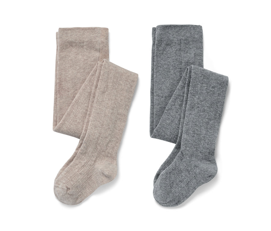 Deux paires de collants pour enfant : une paire beige et une paire grise.