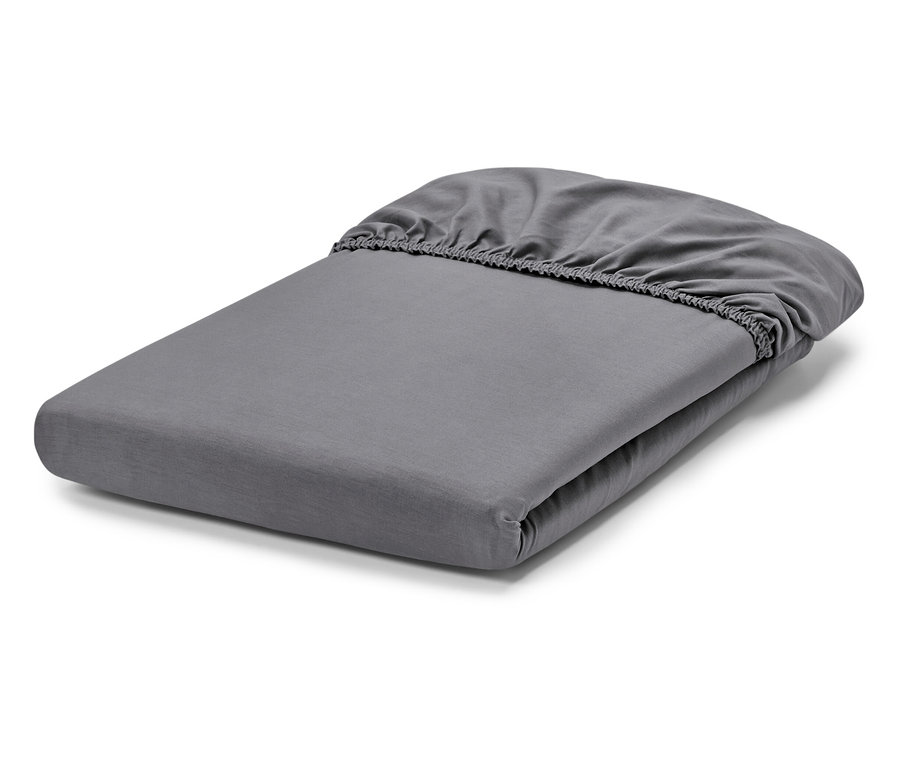 Drap-housse gris plié.