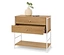 Commode en bois clair avec deux tiroirs, dont un est ouvert, et un cadre en métal blanc. Un vase avec une plante verte est posé sur le dessus.