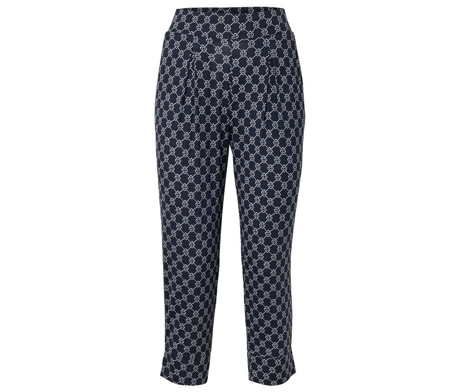Pantalon bleu marine avec motif géométrique blanc.