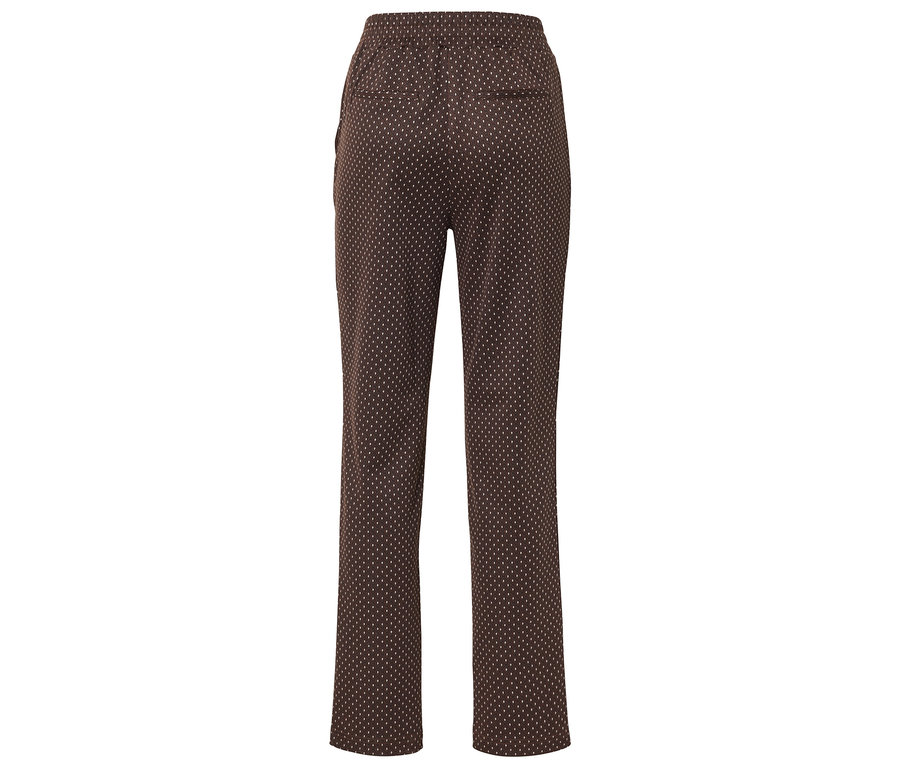 Pantalon marron à petits pois blancs, photographié de dos.